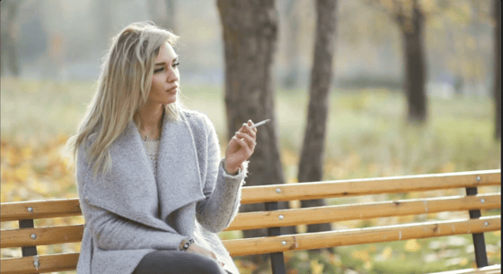 20. young-beautiful-business-woman-smoking-a-cigarette-in-the-park-autumn-background-SBV-319178873-HD
